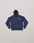 Navy blue hoodie with a small white logo on a light gray background