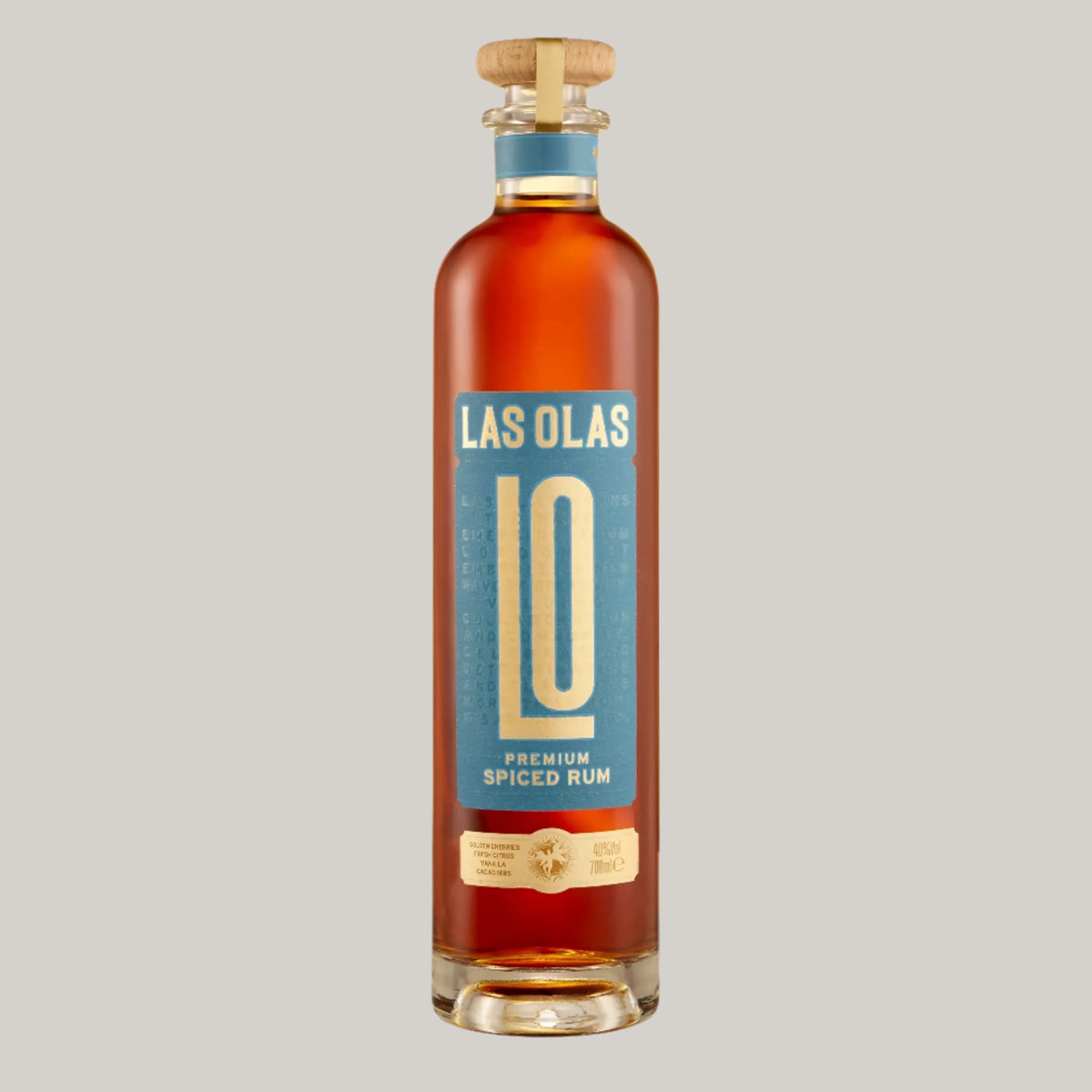 Bottle of Las Olas Premium Spiced Rum on a gray background