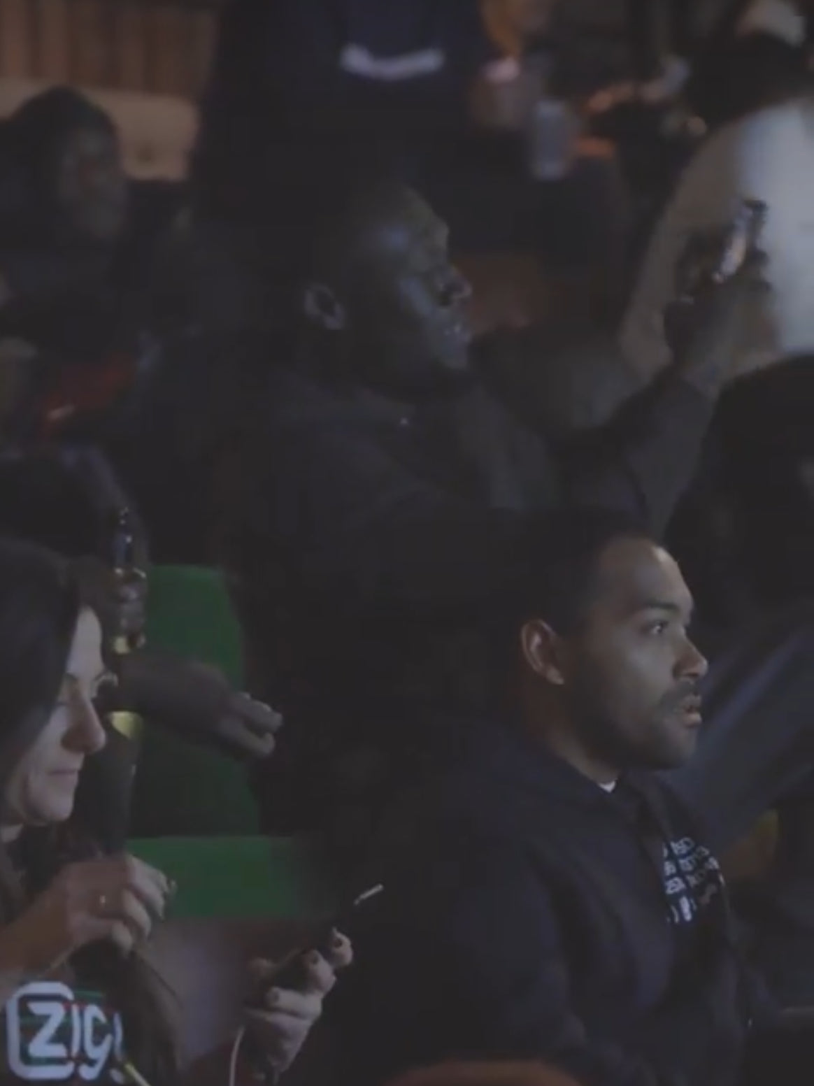 stormzy in a darkened room, possibly at an event or gathering.